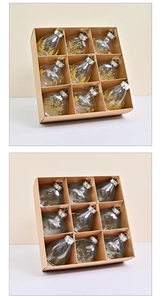 Set of nine clear PET Christmas ornaments with gold snowflake and reindeer patterns