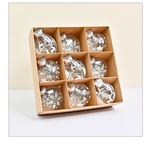 Set of 9 clear Christmas ball ornaments with reindeer and snowflake prints in a box