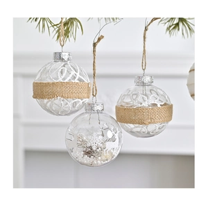 Close-up of clear Christmas ornaments with burlap, glitter spirals and reindeer inside