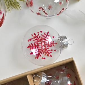 Transparent PET Christmas ornament ball with red glitter snowflake and candy cane patterns