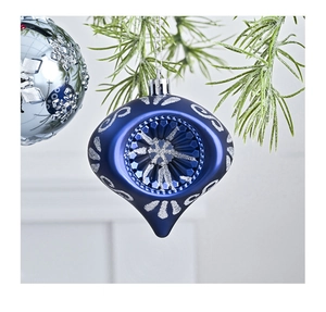 Detail of sapphire blue onion Christmas ball with silver glitter and concave refraction