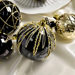 Set di palline di Natale lusso nero e oro con decorazioni glitterate eleganti