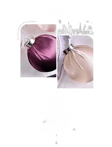 Macro detail of satin and velvet Christmas baubles with elegant metallic hanging loops