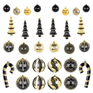 Set di palline di Natale nero e oro con decorazioni varie e alberi su sfondo bianco
