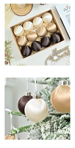 Detailed macro view of 12 elegant satin gradient Christmas ball ornaments on a snowy tree