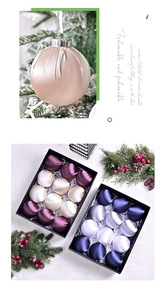 Detail view of premium satin Christmas ornaments in a luxury black gift box with ribbons