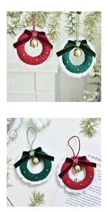 Close-up of red and green knitted Christmas wreaths with velvet bows and golden bells