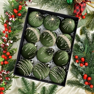 Macro view of velvet Christmas balls with silver glitter patterns in a black gift box