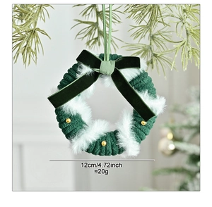 Detail of 12cm knitted Christmas wreath with green velvet bow and golden beads