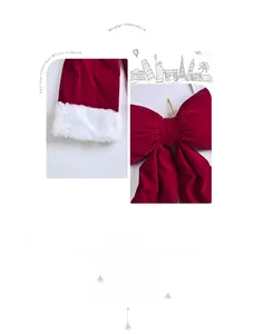 Detailed view of red velvet Christmas fabric with plush white faux fur trim and bow