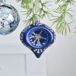 8cm dark blue teardrop Christmas ball with silver glitter scrolls on pine branch