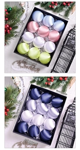 Close-up of 12 luxury satin Christmas balls in 8cm size inside a premium gift box