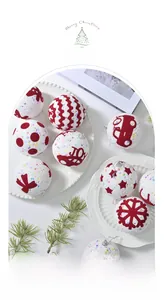 Detail of festive foam Christmas balls with red glitter patterns and silver hanging loops