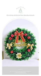 Close-up of Christmas wreath with pine needles, red ornaments and Merry Christmas sign