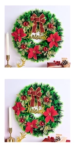 Detail view of festive Christmas wreath with red bows and gold Merry Christmas sign