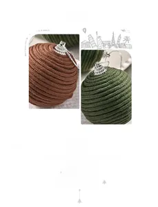 Macro view of handcrafted woven cotton rope Christmas ball with dense texture and metallic cap