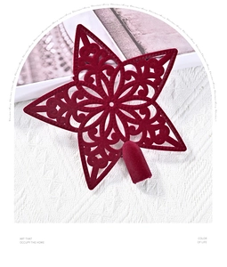 Macro view of red flocked star ornament with intricate cutout patterns for Christmas trees