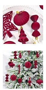 Macro detail of burgundy flocked Christmas ornaments with velvety texture and gold hooks