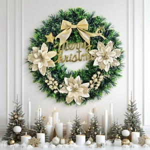 Couronne de Noël avec nœuds dorés et signe Merry Christmas sur mur blanc chic