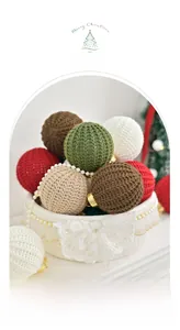 Close-up of colorful handmade crochet Christmas balls in a lace basket with festive decor