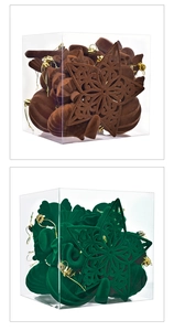 Detail of flocked velvet Christmas ornaments in brown and green with golden hanging strings