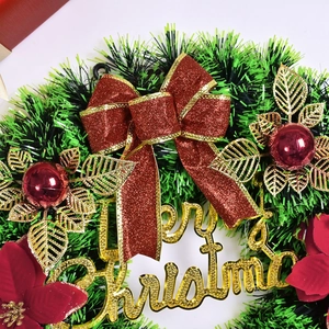 Flocked Christmas wreath with red glitter bow and gold Merry Christmas sign