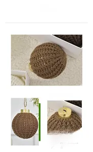 Macro detail of brown hand-knitted Christmas ornament ball with a metal cap and jute rope
