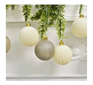 Detail of burgundy flocked and glitter Christmas ball ornaments on a green pine tree