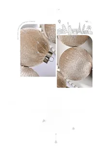 Close-up of champagne velvet Christmas ball with silver glitter stars and metal hook
