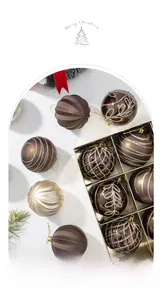 Detailed view of bronze and champagne Christmas balls with hand-painted glitter patterns