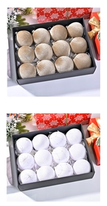 Detail of velvet and woven Christmas balls with star embroidery in a 12-piece black gift box