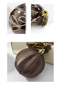 Detail of bronze Christmas balls with silver glitter vine patterns and wavy texture