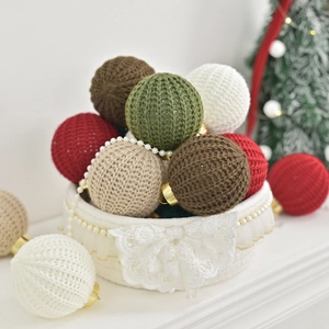 Handmade crochet Christmas balls in multi-color yarn for festive tree decoration