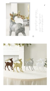 Close-up of glittery Christmas reindeer figurines in gold and silver for holiday decor