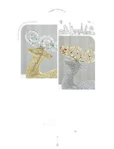 Detailed view of glittering gold and silver reindeer ornaments with elegant hollow antlers