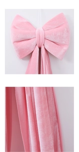 Detailed view of large pink velvet bow with soft texture for wedding and party decor