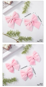 Detailed size comparison of pink velvet Christmas bows with soft texture and dimensions