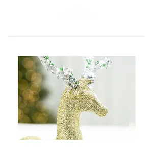 Close-up of golden glitter reindeer ornament with beaded antlers for Christmas decor
