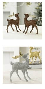 Detail of Christmas reindeer ornaments with glitter finish and metallic antlers decor