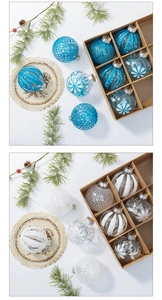 Detail of blue and white Christmas ornaments set with glitter and floral patterns