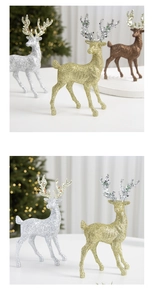 Detail of glittered reindeer Christmas ornaments with festive gold and silver finishes