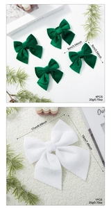 Detail of green velvet Christmas bows and large white bow with holiday decorations