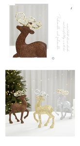 Detail view of glitter-coated Christmas reindeer ornaments for holiday tabletop decor
