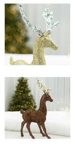 Macro detail of glittering gold Christmas reindeer ornament with festive sparkle finish