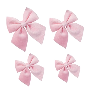 Set of four soft pink velvet Christmas bows for tree ornaments and holiday decor