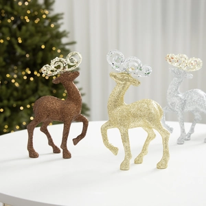 Three elegant glittery Christmas reindeer figurines in gold, silver, and brown for decor