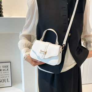 White pebbled leather square crossbody bag with gold H-buckle and shoulder strap