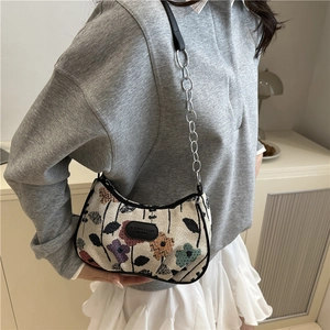Floral retro shoulder bag with chain strap and vintage abstract pattern on woven fabric