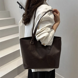 Minimalist large capacity dark coffee leather tote bag with elegant shoulder straps
