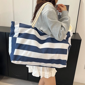 Large capacity navy striped canvas tote bag with thick woven rope handles and side pockets